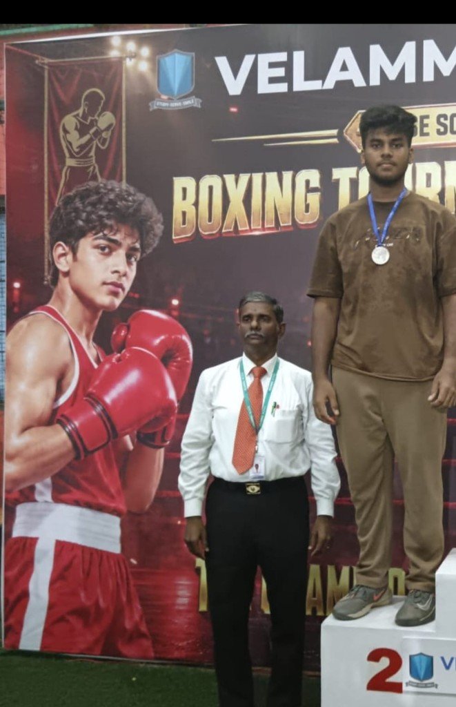 Mohammed Saifullah with his silver medal on the boxing podium